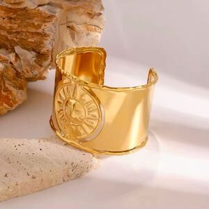 Golden Solstice: Sculptural Sun Emblem Cuff Bracelet Antropologie